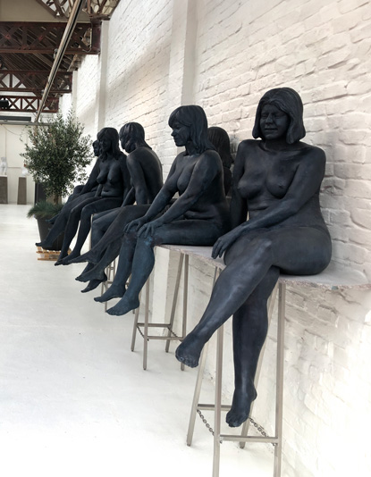 Black statues exhibited on Atelier Verbeke